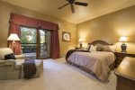 Master suite with king bed, private balcony, and en-suite bathroom.